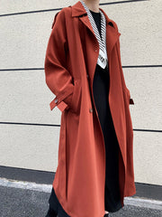 Drapey British style loose mid-length trench coat